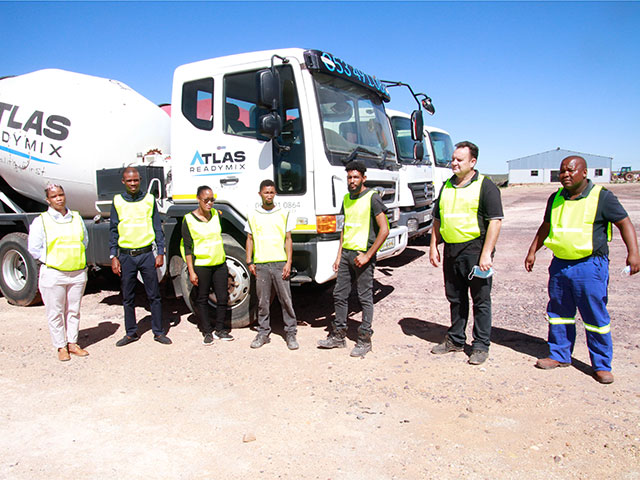 Staff standing next to Atlas Vehicle